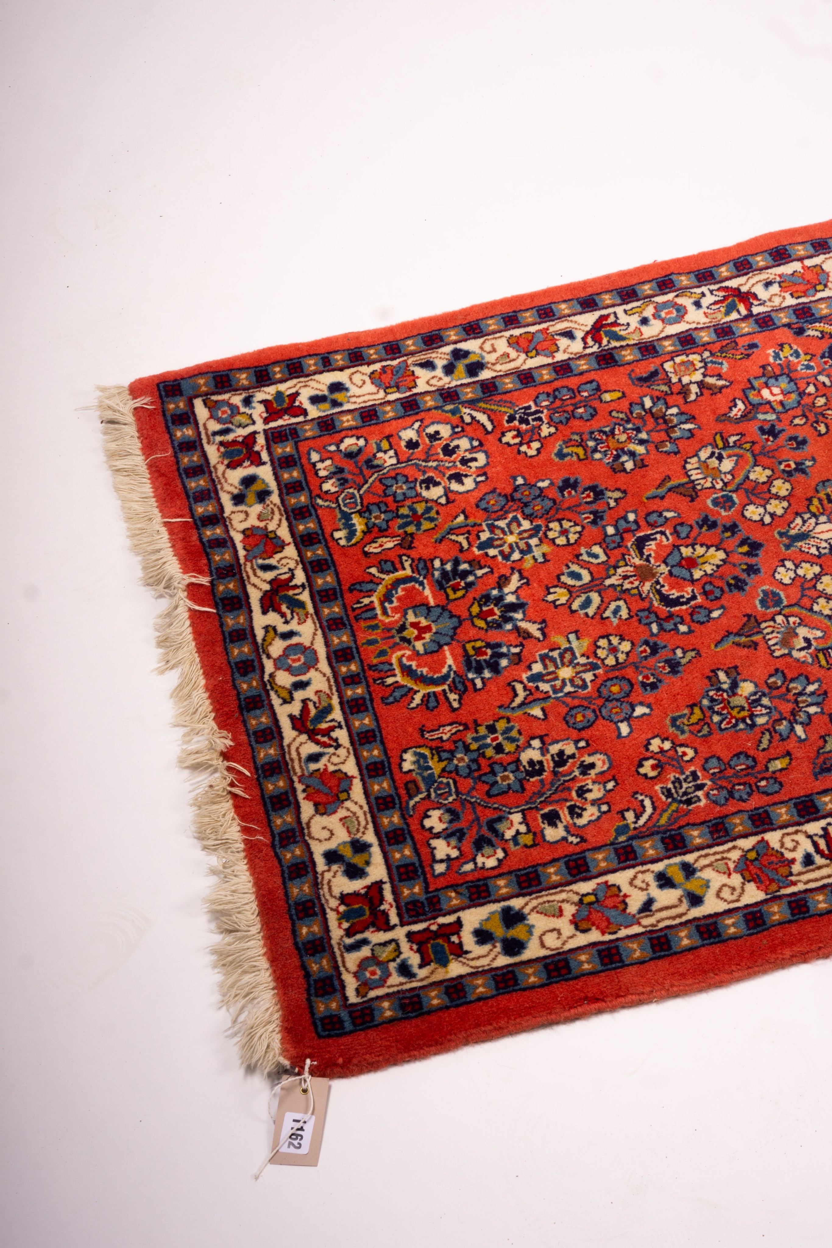 A Persian red ground runner, 202 x 83cm